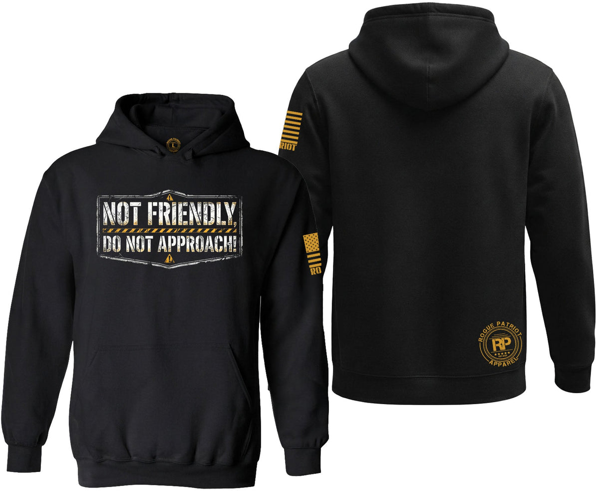 Black pullover hoodie shown from the front and back on a white background. The front features a distressed white graphic that reads 'NOT FRIENDLY DO NOT APPROACH!' with a small gold emblem below.