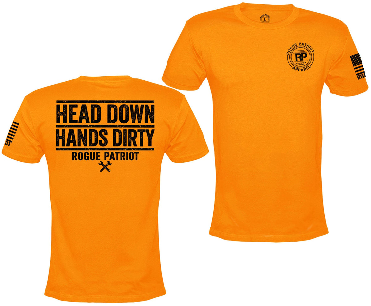 Bright orange short-sleeve t-shirt shown from both front and back on a white background. The front features a circular black 'Rogue Patriot' logo on the left chest, and the back features bold black text reading 'HEAD DOWN HANDS DIRTY ROGUE PATRIOT' with a small crossed-tool graphic below.