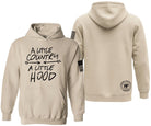A light beige pullover hoodie shown from both front and back on a plain white background. The front features the black text 'A LITTLE COUNTRY A LITTLE HOOD' with a small American flag graphic on the sleeve.
