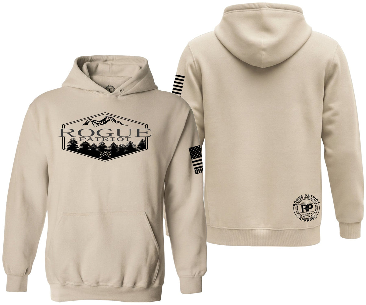 A beige pullover hoodie shown from both the front and back on a plain white background. The front features a black graphic of a mountain range with the text 'ROGUE PATRIOT AND PNW'.